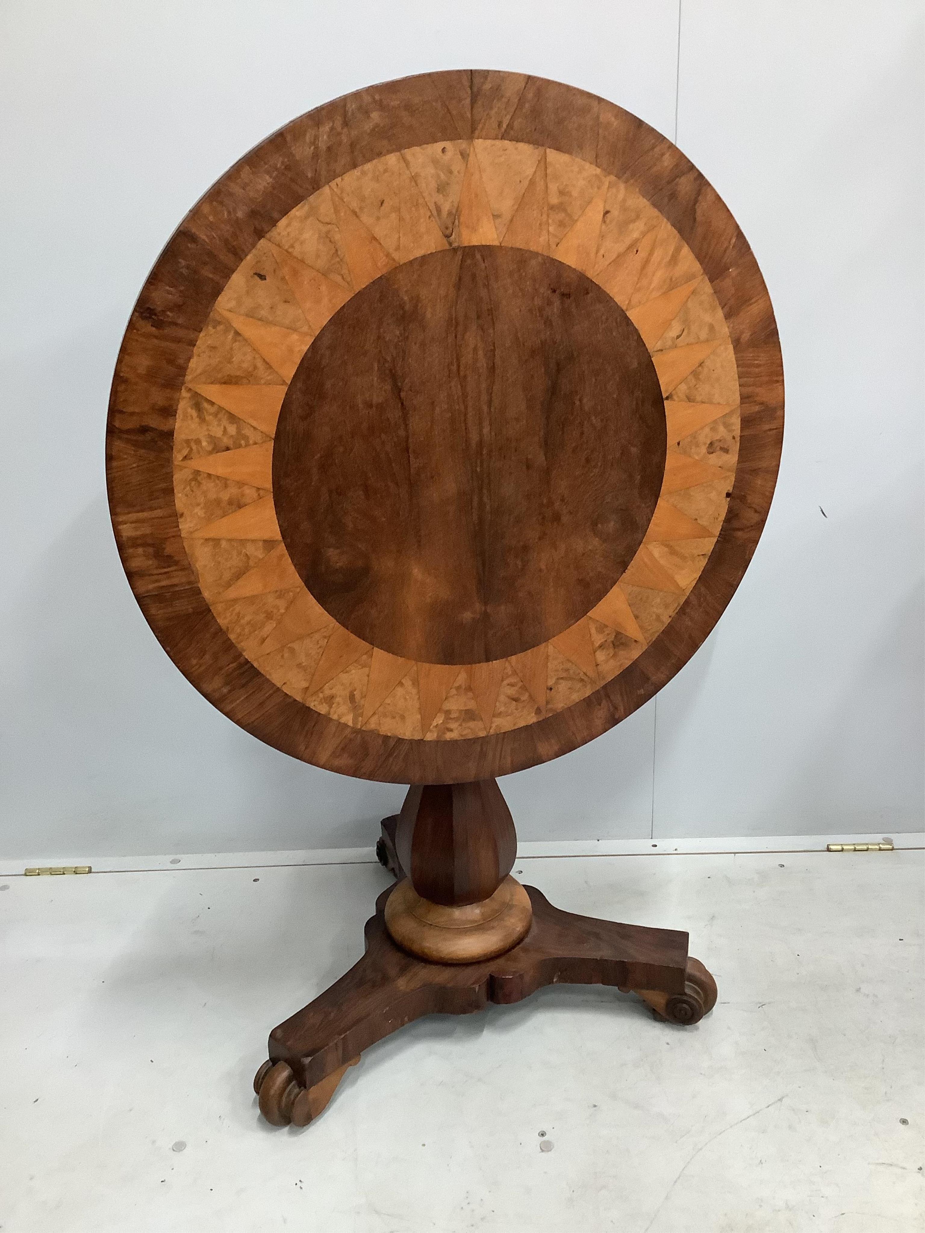 An early 19th century Continental rosewood, walnut and satinwood centre table, with parquetry top, diameter 76cm, height 75cm. Condition - fair to good